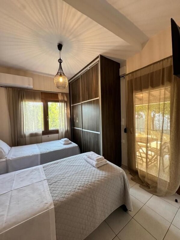 Apartment, Garden View | In-room safe, iron/ironing board, free WiFi, bed sheets