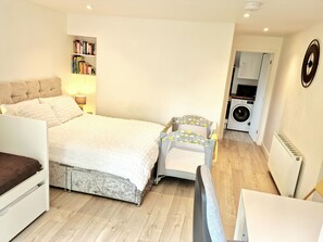 1 bedroom, desk, iron/ironing board, travel crib