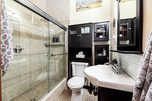Shower, hair dryer, towels, shampoo