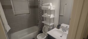 Shower, towels, soap, toilet paper