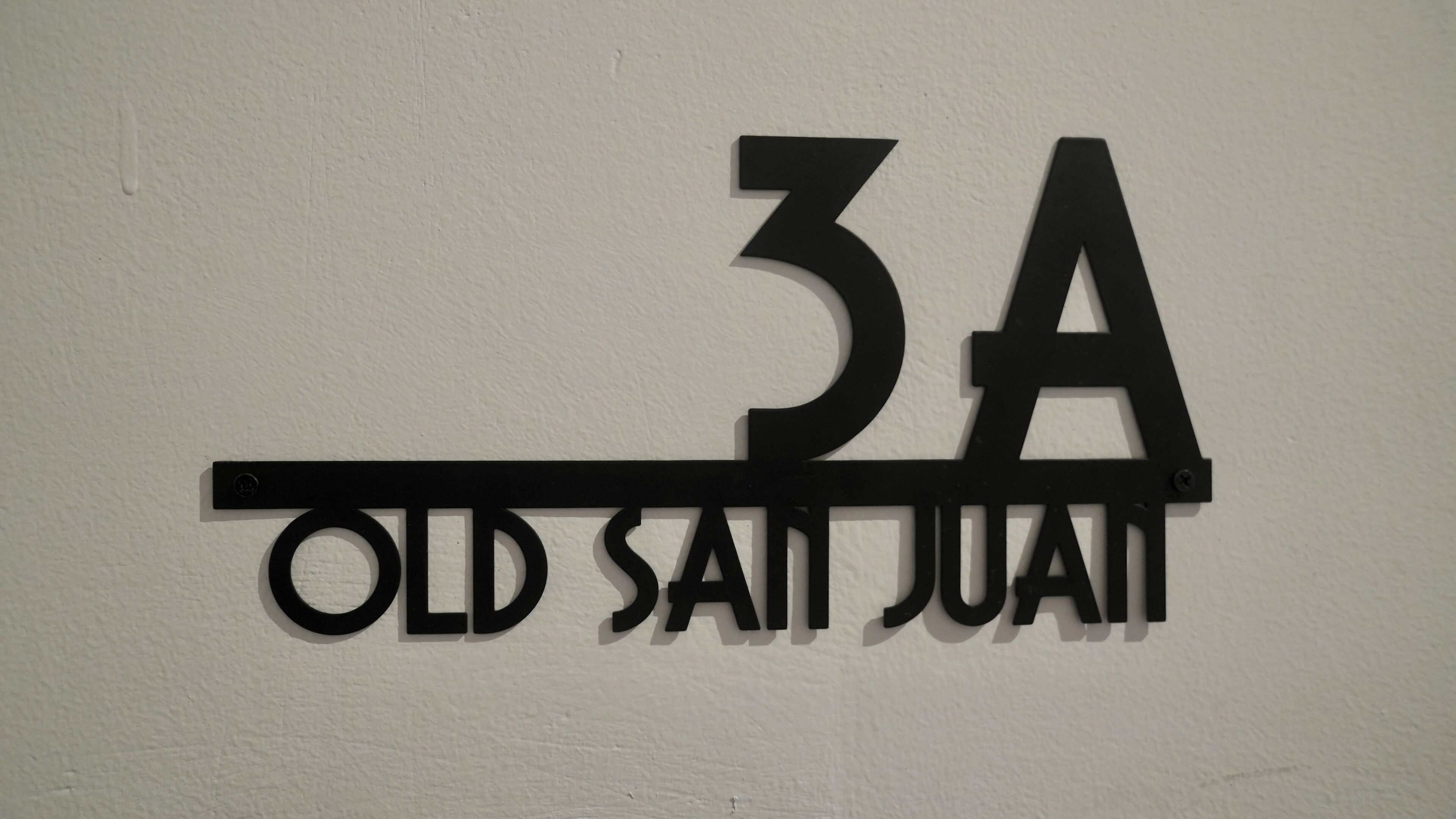 A wall-mounted sign with the number '3A' and the text 'OLD SAIT JUAN'.