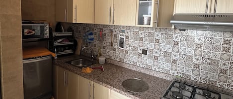 Horno, placa de cocina, servilletas de papel