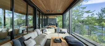 Outstanding 5 bed 6 bath cottage on Lake Joseph with Tennis Studio