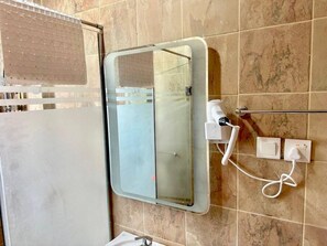 Shower, hair dryer, towels, toilet paper