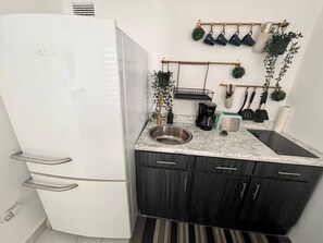 Fridge, microwave, coffee/tea maker, toaster