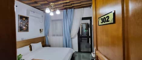 Standard Double Room, City View | Desk, laptop workspace, blackout drapes, soundproofing