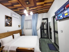 Standard Double Room, City View | Desk, laptop workspace, blackout drapes, soundproofing - Justina Guest House Hotel (Douala)