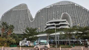A modern building with a curved facade and multiple levels.