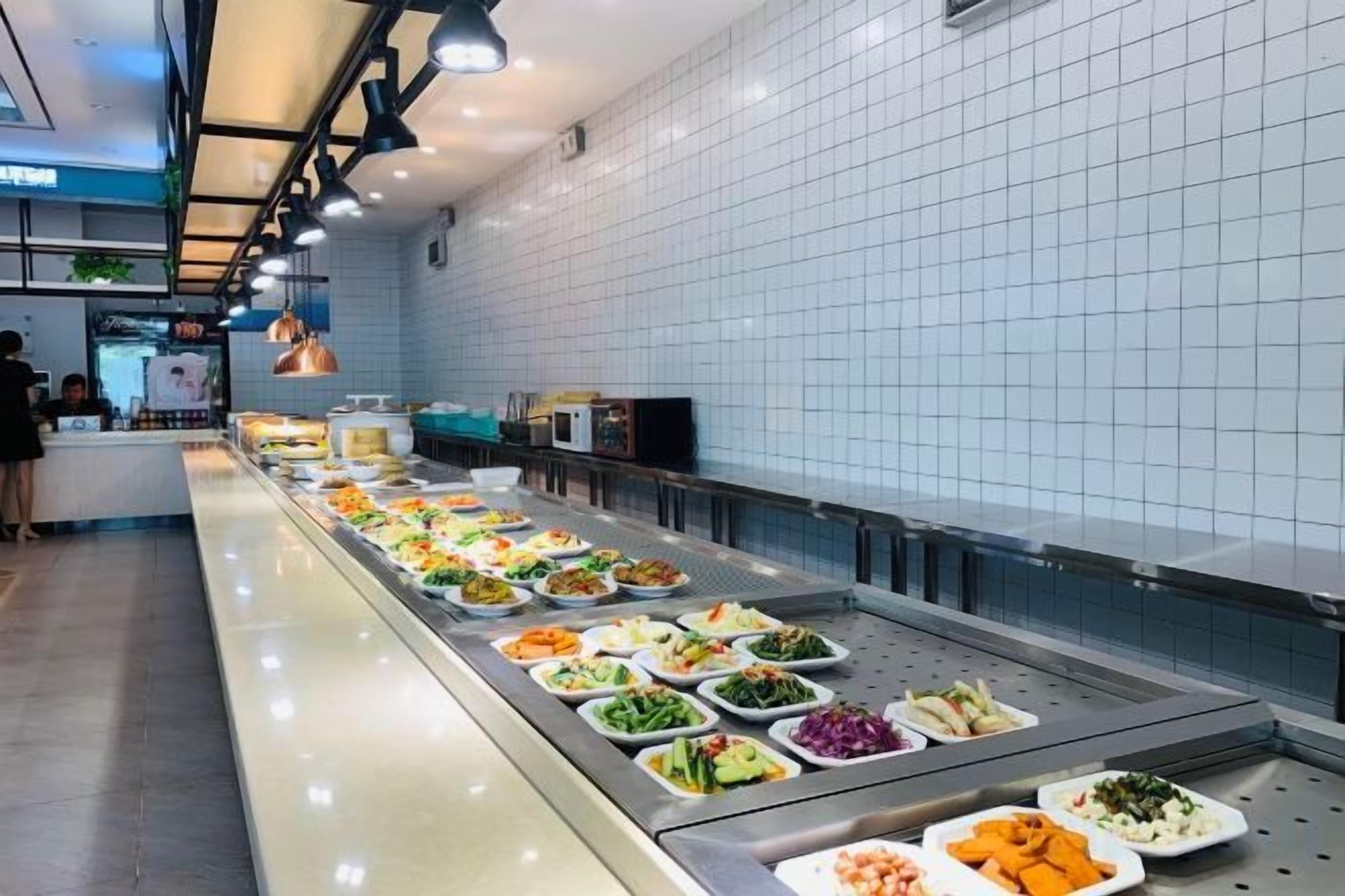 A buffet area with various food options.