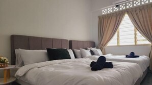 A hotel room with two beds, a bedside table, and a window with curtains. - Petaling Jaya 5 BedRoom Landed SS17/ for up to 18pax/Jaya1/Phileo/UM (Petaling Jaya)