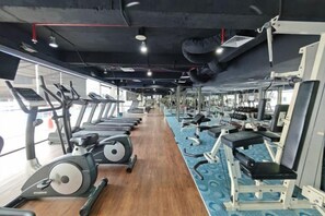 A gym with treadmills, stationary bikes, and weight machines. - Meetsuite at Kota Kinabalu (Kota Kinabalu)