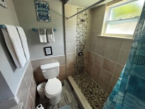 Family Apartment, Courtyard View | Bathroom | Hair dryer, towels, soap, shampoo