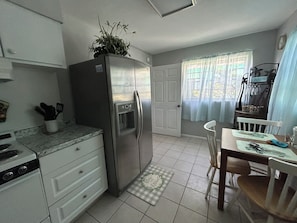 Family Apartment | Private kitchen | Full-size fridge, microwave, stovetop, coffee/tea maker - Surfside Suites (Cocoa Beach)