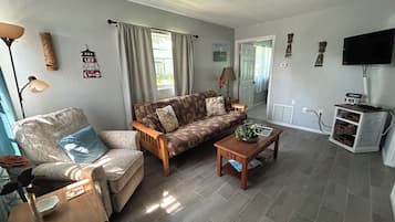 Apartamento família | Área de estar | Brinquedos