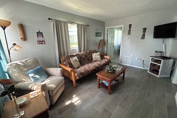 Family Apartment | Living area | 40-inch Smart TV with cable channels, toys