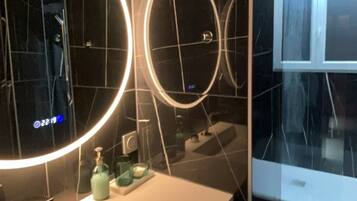 Shower, hair dryer, towels, soap