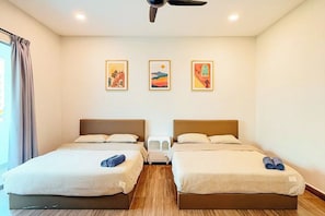 A hotel room with two beds, a ceiling fan, and three framed artworks on the wall. - Golden Sweet Home @ CH Golden Hills (Night Market) - 2 Storey Terrace House (Brinchang)
