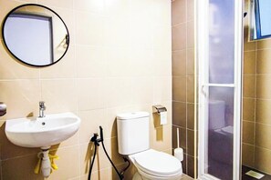 A bathroom with a sink, toilet, and a shower area. - Lovely Family Suites at Razak City Kuala Lumpur by HCK (Kuala Lumpur)