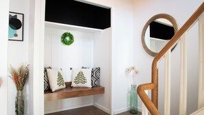 A staircase with a wooden handrail and a mirror on the wall. - Central 3BR Getaway/ Family-sized, Free Parking & AC/ Near Downtown (Edmonton)