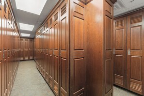 A corridor with wooden lockers, a tiled floor, and a skylight ceiling. - Dl8497-2 (Keystone)