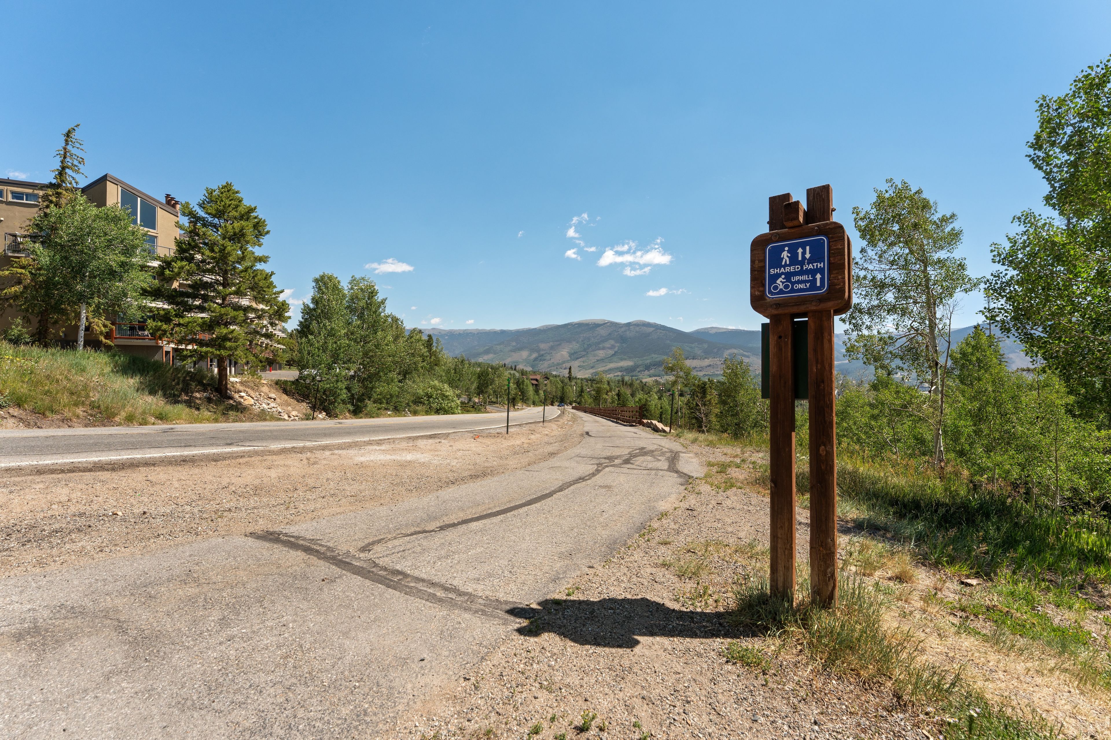 A shared path sign indicating a bicycle-only uphill route.