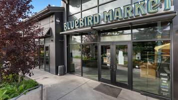 A storefront with a large sign reading 'BLUEBIRD MARKET'.