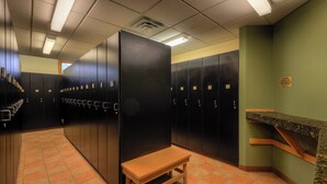 A locker room with multiple lockers, a bench, and a counter. - Expedition Station #8581 (Keystone)