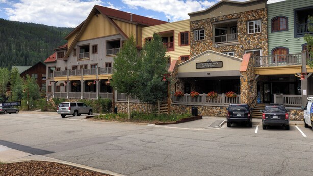 A multi-story building with a stone facade and a sign reading "EXPERIENCE STATION". - Expedition Station #8581 (Keystone)