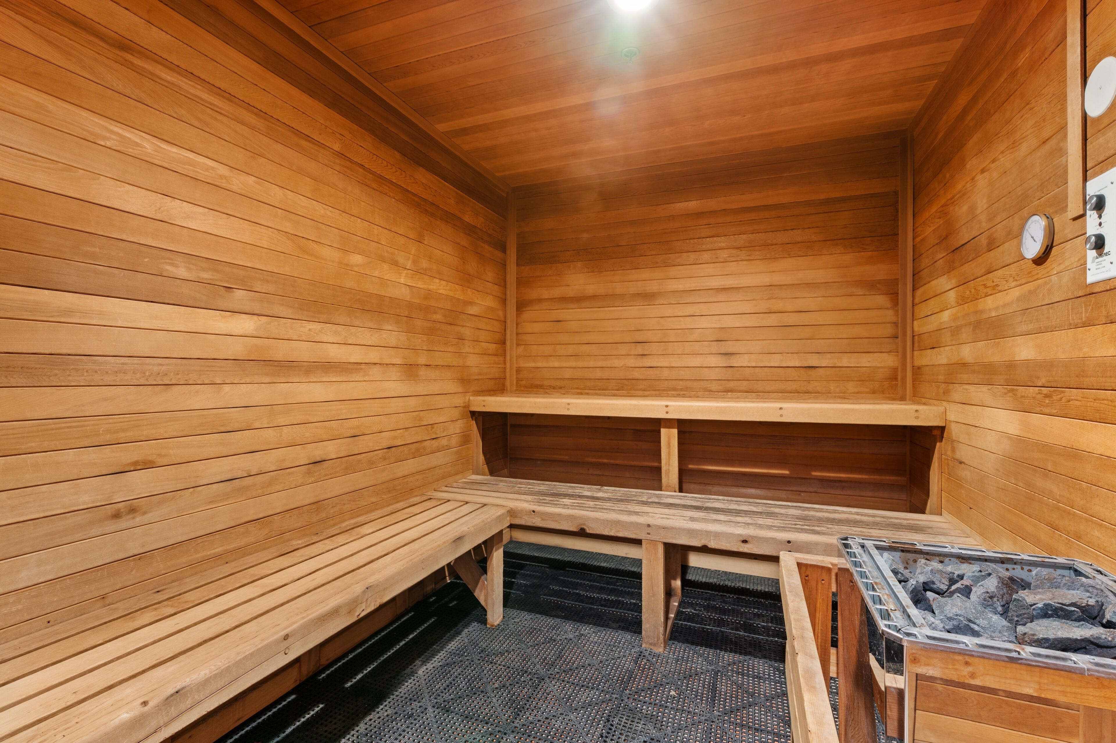 A sauna with wooden walls and benches.
