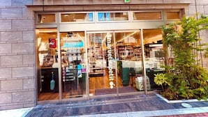 A storefront with the name 'maruetsu supermarket' visible above the entrance. - Tokyo Asakusa House (Tokyo)