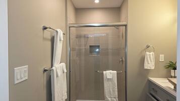 Shower, hair dryer, towels, soap