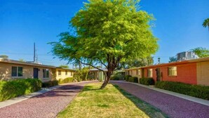 A row of single-story mobile homes with a central tree-lined driveway. - Bright and Cozy Tucson Condo - Ideal for families, couples and friends (Tucson)