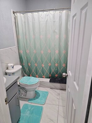 Shower, hair dryer, towels, soap