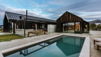 Seasonal outdoor pool, pool loungers