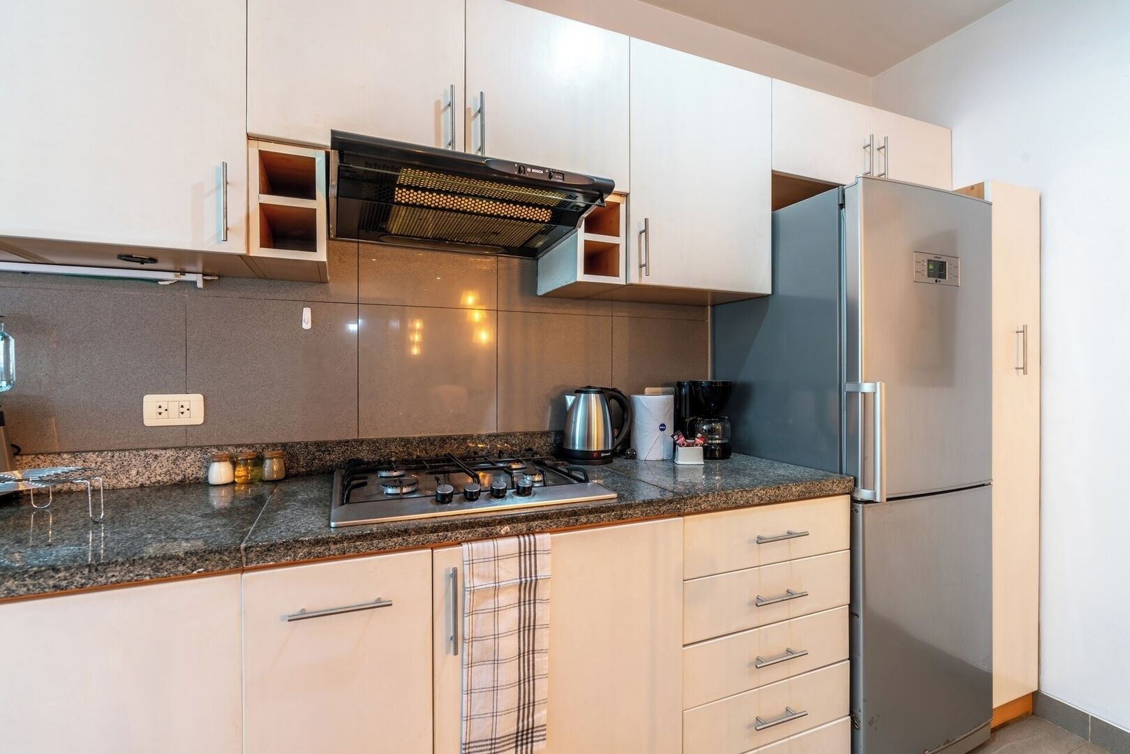 Fridge, microwave, coffee/tea maker, cookware/dishes/utensils