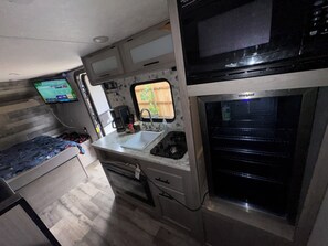 Fridge, microwave, stovetop, coffee/tea maker