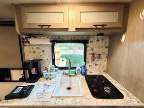 Fridge, microwave, stovetop, coffee/tea maker