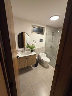 Shower, hair dryer, towels, soap