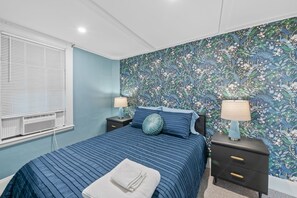 1 bedroom, desk, iron/ironing board, travel crib
