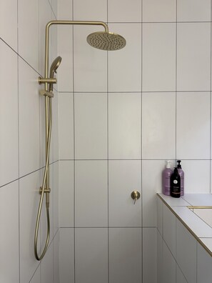 Shower, hair dryer, towels, soap