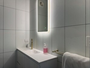 Shower, hair dryer, towels, soap