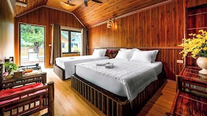 A wooden-themed room with two beds, a ceiling fan, and a view of the outdoors. - Tam Coc Holiday Retreat (Nam Hoa Lu)