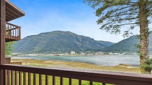 A wooden deck with a view of a river and mountains. - Oceanfront w/ Incredible Views (Juneau)