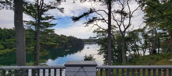 All Decked Out: 5BR/4BA Coastal Retreat with Panoramic Water Views and Shared Dock Access