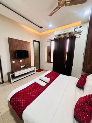 Habitación Deluxe | Camas supletorias, wifi gratis, ropa de cama