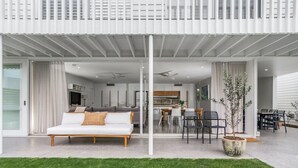 A modern house with a spacious living area, a dining area, and a kitchen.