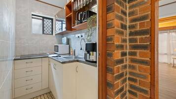 Fridge, microwave, toaster, cookware/dishes/utensils