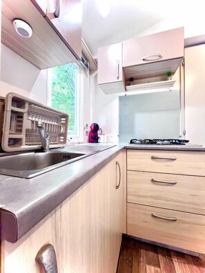 Fridge, microwave, stovetop, coffee/tea maker
