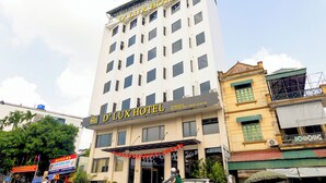 A multi-story hotel with a prominent sign reading "D'LUX HOTEL". - D'Lux Hotel (Hanoi)