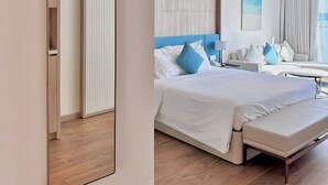A modern hotel room with a large bed, a seating area, and a large mirror. - Sea view Àlacarte Ha Long Bay Apartment (Bai Chay)